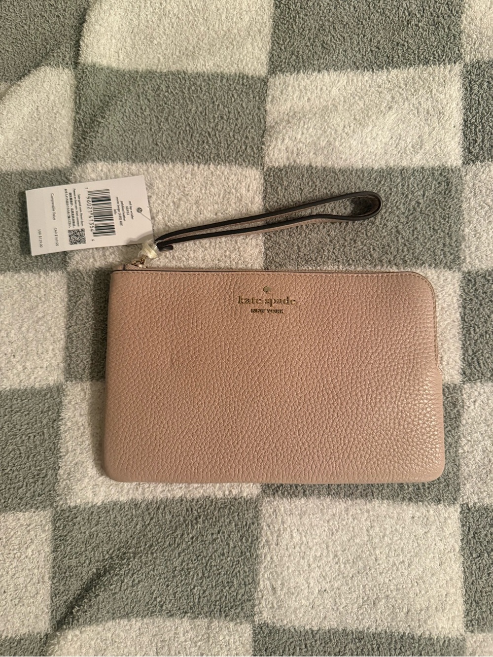kate spade pebble leather wristlet in warm beige